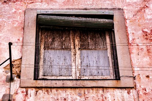 Old and colorful damaged facade in Lisbon