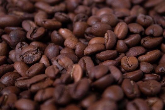 close up Freshly roasted coffee beans background. top view.