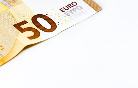 Detail of a 50 euro banknote isolated on a white background. European Union currency. Economics and finance. Paper cash. Copy space