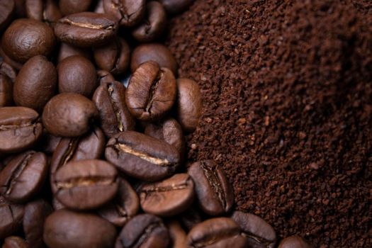 pile of ground or instant coffee and roasted coffee beans seeds. background.