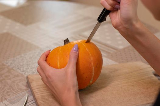 the process of making a Halloween pumpkin. horror theme and Hallowe'en.