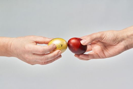 A couple beats Easter eggs during the celebration. Traditional beating of easter eggs