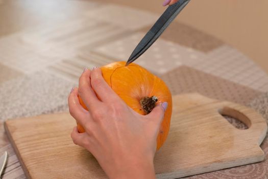 the process of making a Halloween pumpkin. horror theme and Hallowe'en.