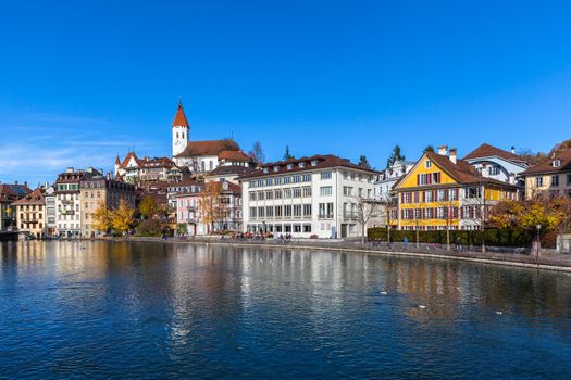Beautiful view of the old town of Thun from the riverside of Aare in autumn, Canton of Bern, Switzerland.
