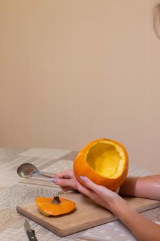 the process of making a Halloween pumpkin. cleansing of seeds. horror theme and Hallowe'en.