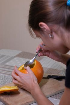 the process of making a Halloween pumpkin. cleansing of seeds. horror theme and Hallowe'en.