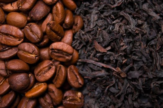 pile stack of dried tea leaves and roasted coffee beans seeds: theine vs caffeine. background .