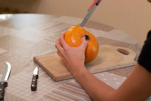 the process of making a Halloween pumpkin. horror theme and Hallowe'en.