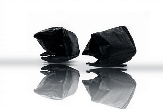 Black colored ankle weights isolated on white.