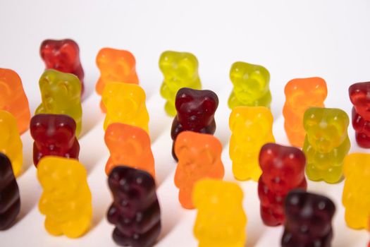 colourful sweet gummy bears isolated on white background.