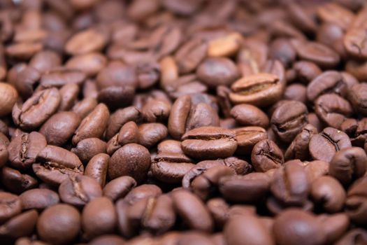 close up Freshly roasted coffee beans background. top view.