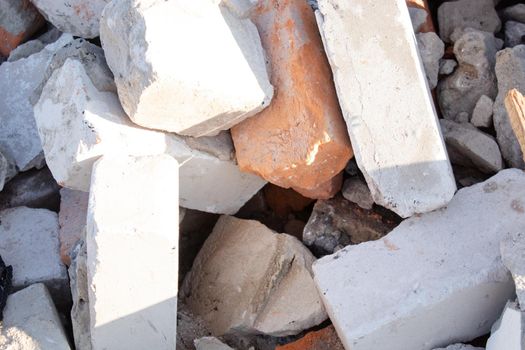 pile of old used bricks. background. construction of houses.