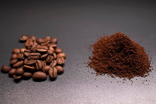 pile of ground or instant coffee and roasted coffee beans seeds. background.