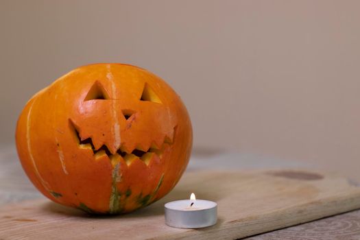 the process of making a Halloween pumpkin. lighted candle. horror theme and Hallowe'en.