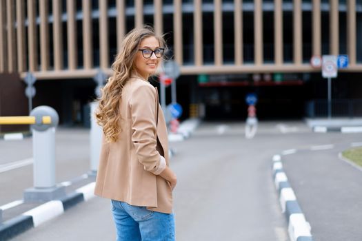 Business Woman Standing Near Indoor Parking Garage Caucasian Female Middle Age Woman in Glasses Outdoors Business Person