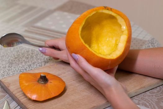 the process of making a Halloween pumpkin. cleansing of seeds. horror theme and Hallowe'en.