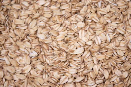 Macro Oatmeal texture. oat flakes food background. Healthy breakfast concept. Muesli cereals