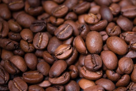 close up Freshly roasted coffee beans background. top view.