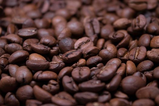 close up Freshly roasted coffee beans background. top view.