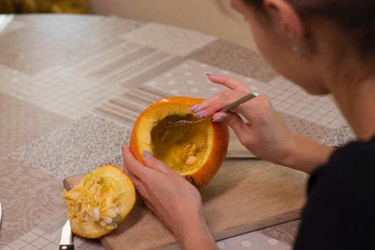 the process of making a Halloween pumpkin. cleansing of seeds. horror theme and Hallowe'en.