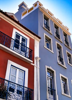 Old colorful houses and streets of Lisbon, Portugal in Spring. Majestic facades and old street lights.