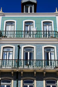 Old colorful houses and streets of Lisbon, Portugal in Spring. Majestic facades and old street lights.