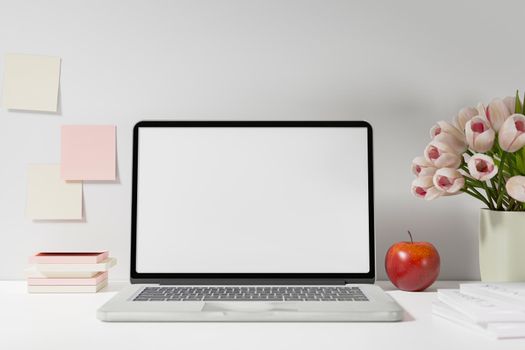 Workspace with mockup blank screen laptop computer. 3D Rendering.