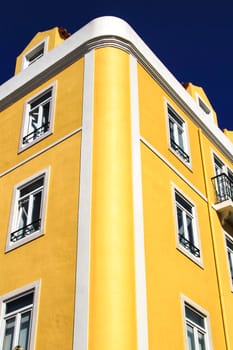 Old colorful houses and streets of Lisbon, Portugal in Spring. Majestic facades and old street lights.