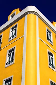 Old colorful houses and streets of Lisbon, Portugal in Spring. Majestic facades and old street lights.