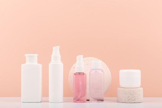 Set of skin care bottles with cosmetic products for skin care and beauty. Variety of skin care products for cleaning, moisturizing and exfoliating skin