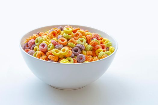 Sweetened Cereal fruit-flavored ring-shaped on a variety of bright colors and a blend of fruit flavors. Red, orange, yellow, green, blue and purple ring-shaped