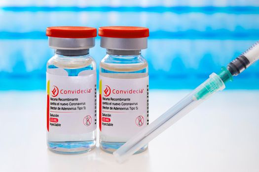 Calgary, Alberta, Canada. March 9, 2021. Covidencia SINOVAC Covid-19 vaccines vials bottles with an injection Syringe for Latin America.