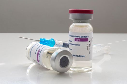 Calgary, Alberta. Canada. April 02, 2021. A couple of AstraZeneca Covid-19 vaccine vials with a syringe