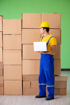 Man contractor working with boxes delivery