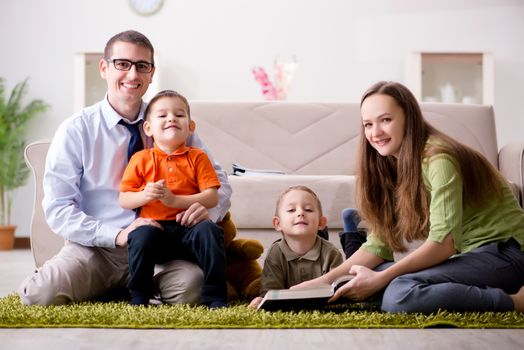 Young family playing in the room at home