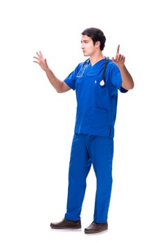 Young male doctor pressing buttons isolated on white
