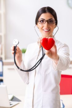 Young doctor in heart care concept