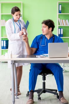 Woman and man doctors radiologists working at the clinic 