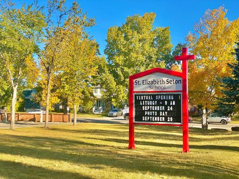 Calgary, Alberta. Canada. Sep 27, 2020. Catholic school sign: St. Elizabeth Seton School. Students during pandemic covid 19, coronavirus. Illustrative