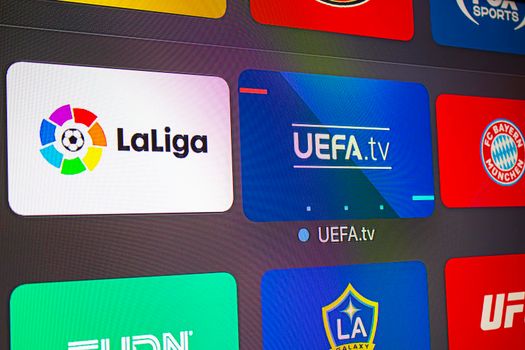 Calgary, AB, Canada. June 11, 2020. Close up of an An apple tv with the UEFA and la Liga application. Concept watching soccer european football.