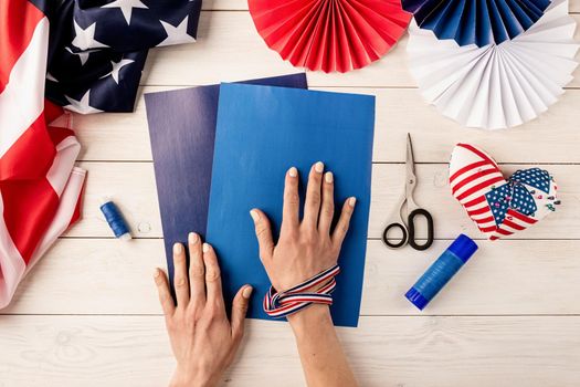 Gift idea, decor July 4, USA Independence Day. Step by step tutorial DIY craft. Making colorful paper fans, step 1 - preparing all instruments, paper, glue, scissors and thread. Flat lay top view