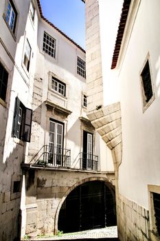 Narrow and colorful streets, majestic facades, windows and balconies of Lisbon, Portugal