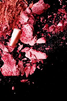 Crushed cosmetics, mineral organic eyeshadow, blush and cosmetic powder isolated on black background, makeup and beauty banner, flatlay design.