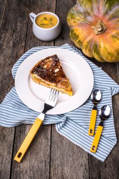 Lunch Pumpkin pie piece with cream soup in Rustic style