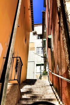 Narrow and colorful streets, majestic facades, windows and balconies of Lisbon, Portugal