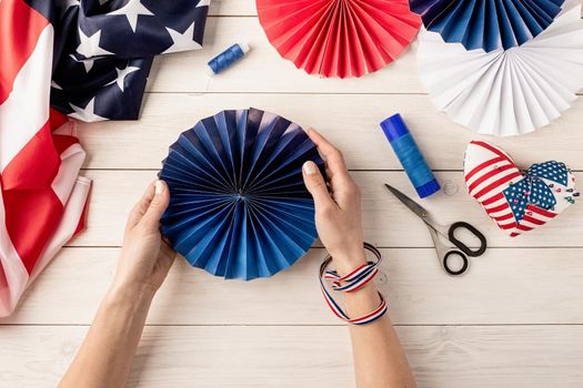 Gift idea, decor July 4, USA Independence Day. Step by step tutorial DIY craft. Making colorful paper fans, step 7 - colorful paper fan is ready. Flat lay top view
