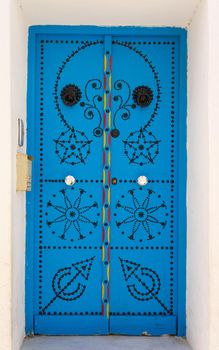 Blue door with ornament from Sidi Bou Said in Tunisia