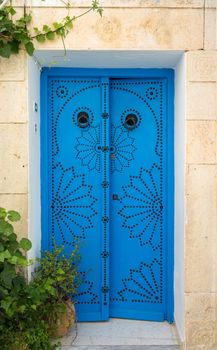 Traditional blue door from Sidi Bou Said in Tunisia. Tunisian culture