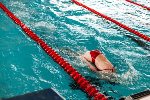 competitive swimming in the pool during training.