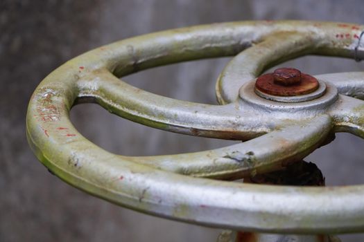 Close-up of a metal close valve turn handle on pipeline, Mossel Bay, South Africa